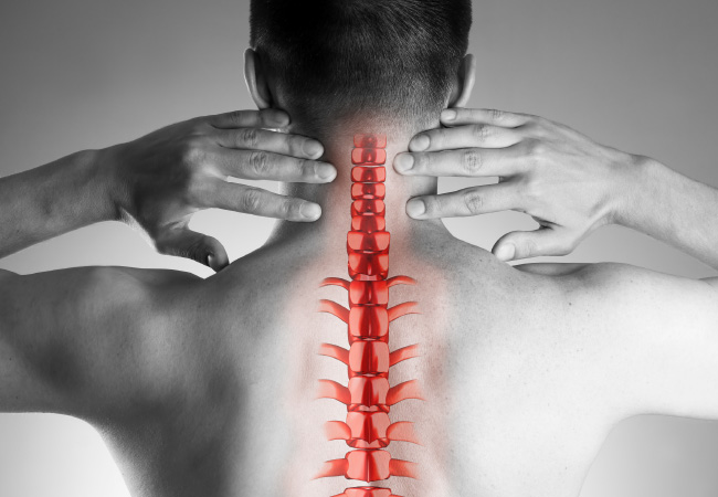 Person holding their neck with a highlighted illustration of the spine to indicate pain or discomfort, captioned: "Are You Living With Neck Pain?