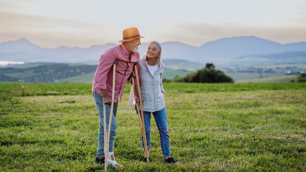 Elderly man on crutches, balance and fall prevention