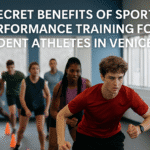 A group of high school student athletes training indoors at a Venice, Florida sports performance facility, practicing agility drills with cones under the guidance of a physical therapist. The photo shows focus and teamwork, highlighting the benefits of youth sports performance training.